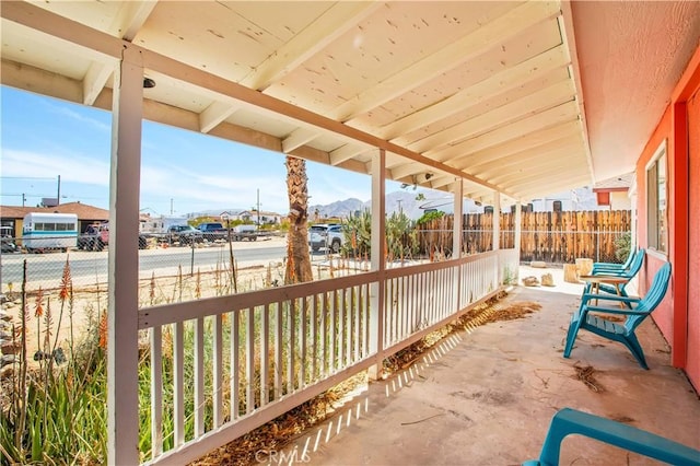 view of patio featuring fence