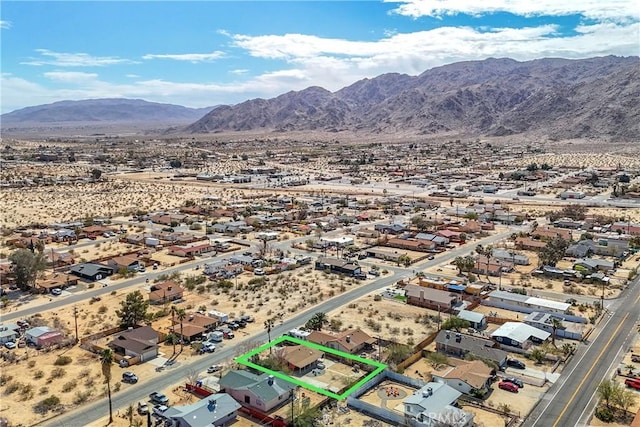 aerial view with a desert view and a mountain view