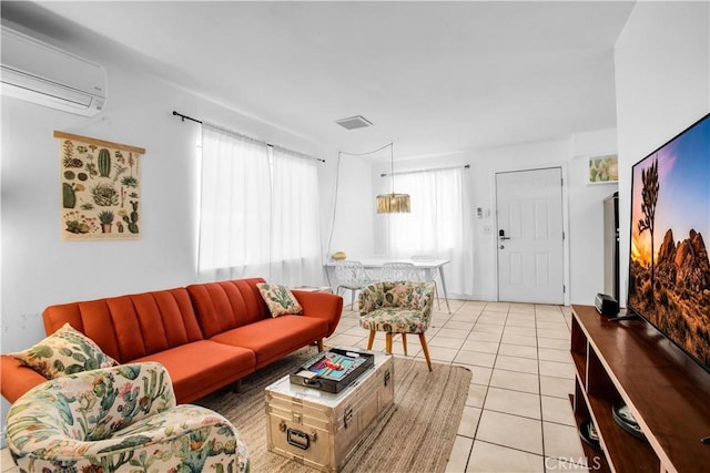 living room with light tile patterned flooring and a wall mounted AC