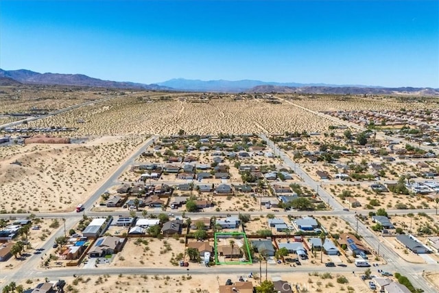 birds eye view of property with a desert view, a rural view, and a mountain view