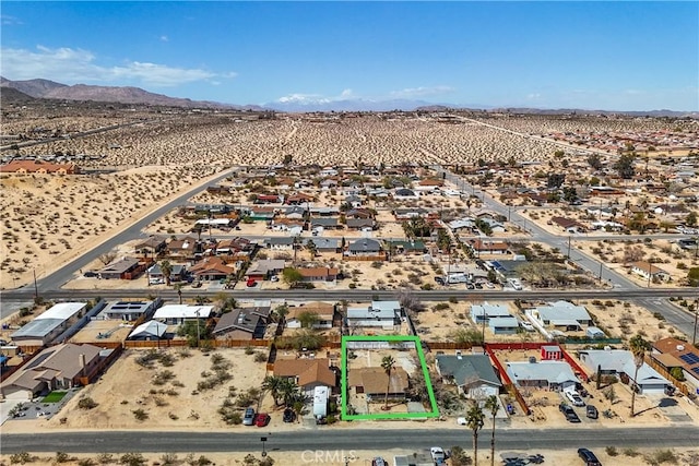 aerial view with a mountain view and a desert view