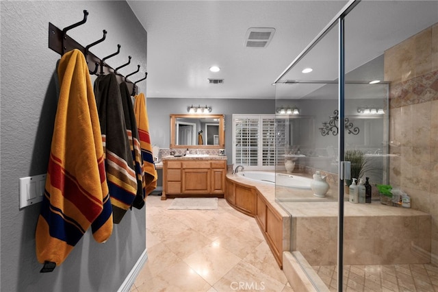 bathroom featuring a stall shower, visible vents, and vanity