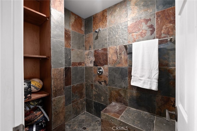 bathroom with a tile shower