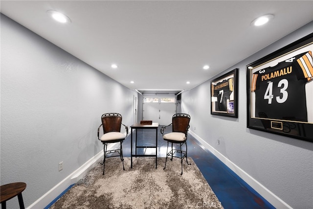 living area with recessed lighting and baseboards