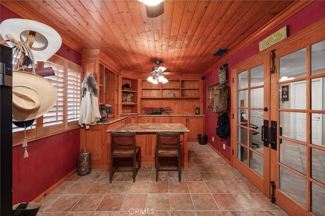 dining room featuring light tile patterned floors, built in features, wooden ceiling, ceiling fan, and french doors