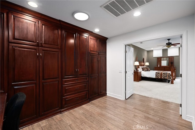 interior space featuring recessed lighting, baseboards, visible vents, and light wood finished floors