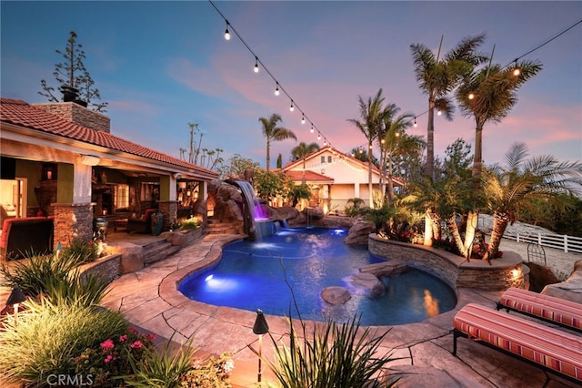 view of pool with a patio area and fence