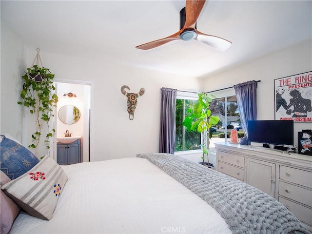 bedroom with a sink, a ceiling fan, and connected bathroom