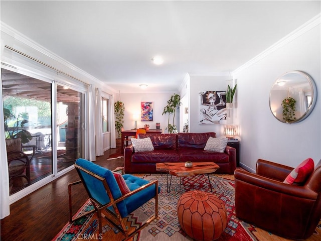 living area featuring ornamental molding and wood finished floors