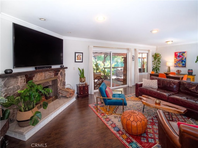 living room with ornamental molding, recessed lighting, a premium fireplace, and wood finished floors