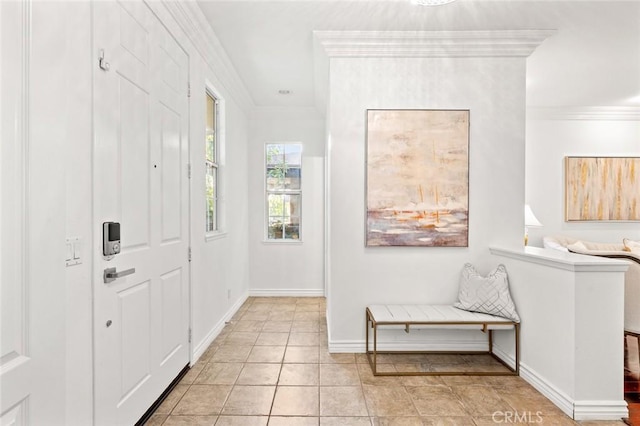 foyer featuring ornamental molding, baseboards, and light tile patterned floors