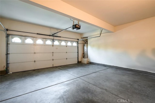 garage with water heater and a garage door opener