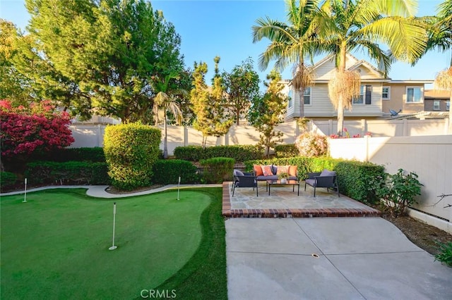 view of home's community featuring outdoor lounge area, a patio area, and a fenced backyard