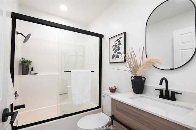 bathroom with toilet, recessed lighting, bath / shower combo with glass door, and vanity