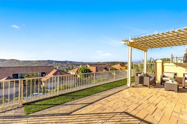 view of patio / terrace with an outdoor living space, fence, and a pergola