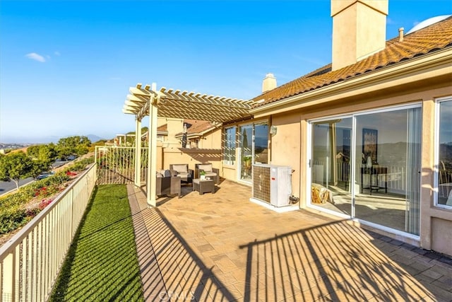 view of patio featuring central AC unit, an outdoor hangout area, and a pergola