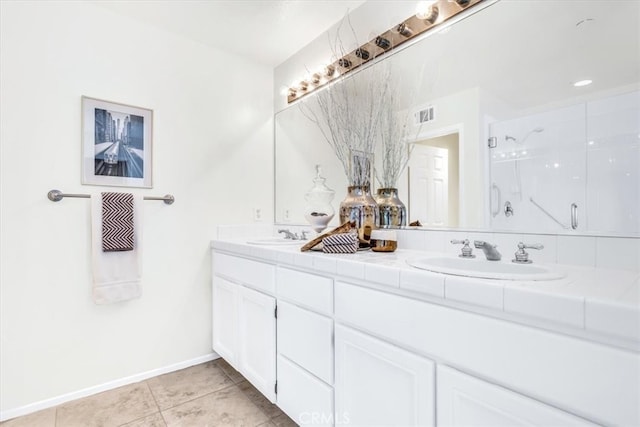 full bathroom featuring a sink, visible vents, double vanity, and a shower stall