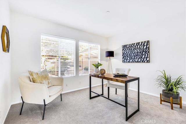 carpeted office with baseboards