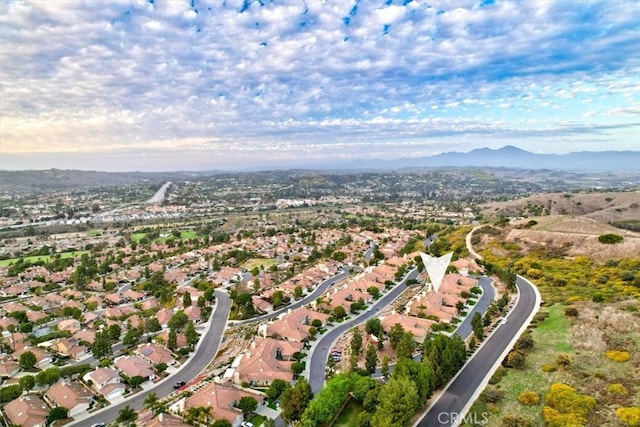 birds eye view of property featuring a residential view and a mountain view