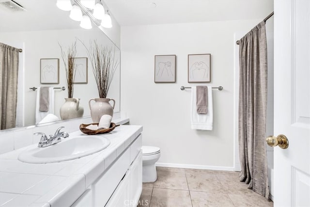 bathroom with visible vents, toilet, tile patterned flooring, baseboards, and vanity