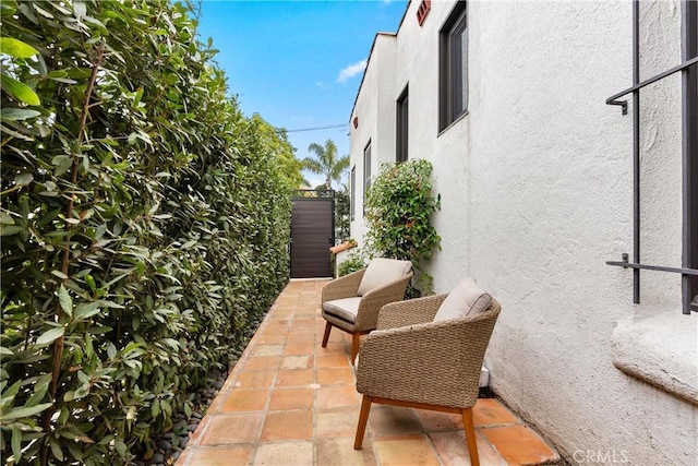 view of patio featuring fence