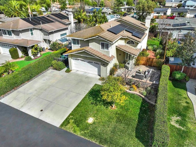 birds eye view of property with a residential view