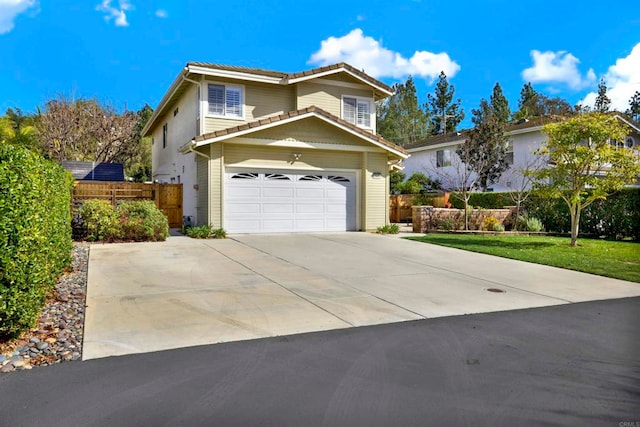 traditional-style home featuring an attached garage, fence, concrete driveway, and a tiled roof