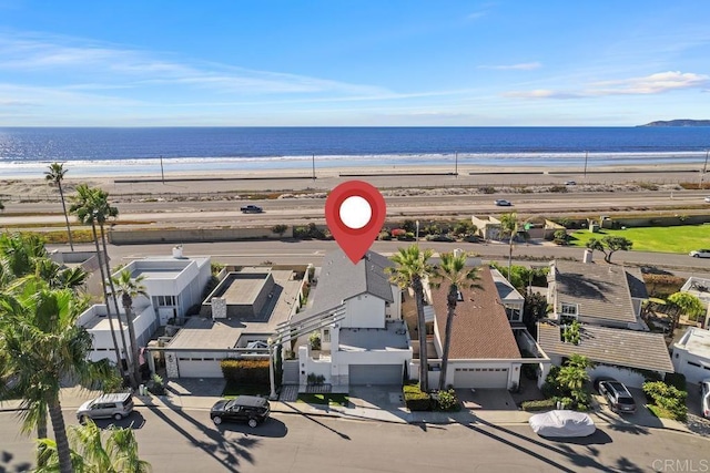 aerial view with a beach view and a water view