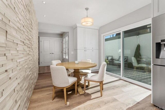 dining area with light wood-style floors