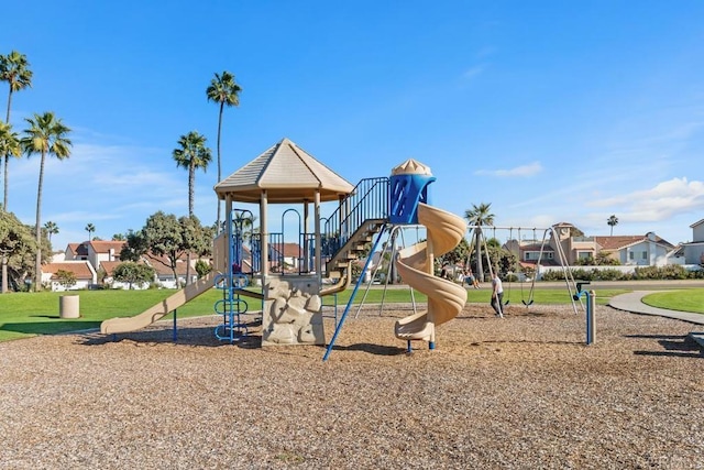 community play area with a lawn