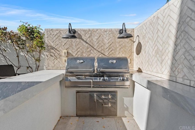 view of patio featuring exterior kitchen and area for grilling