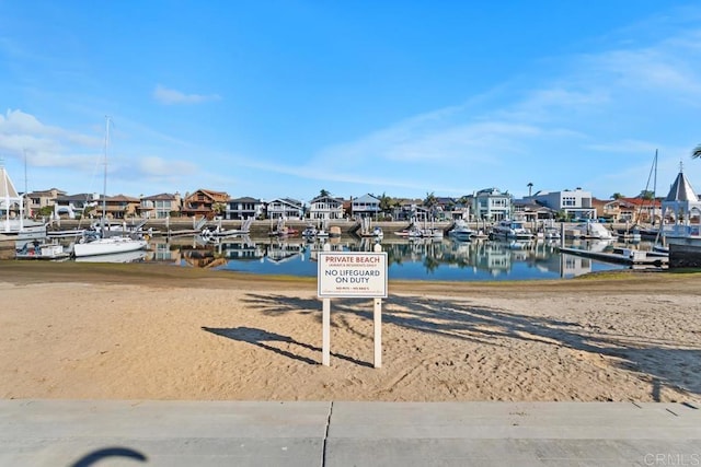 exterior space featuring a water view and a residential view