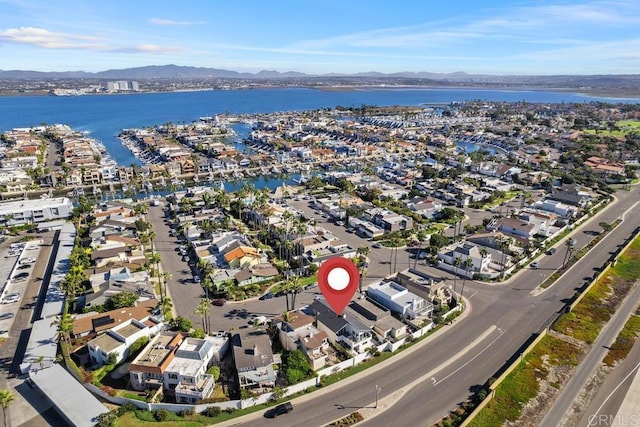 birds eye view of property featuring a residential view and a water and mountain view