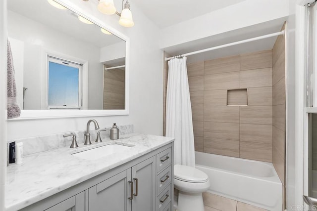 bathroom with tile patterned flooring, shower / tub combo with curtain, vanity, and toilet