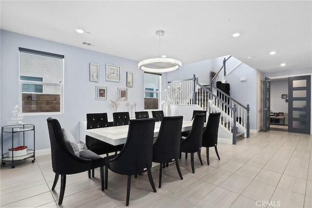 dining room with light tile patterned flooring, recessed lighting, visible vents, baseboards, and stairs