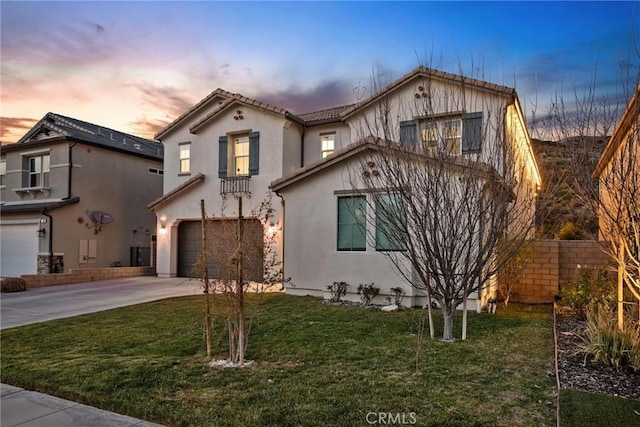 view of front of property featuring a garage, central AC, driveway, a lawn, and stucco siding