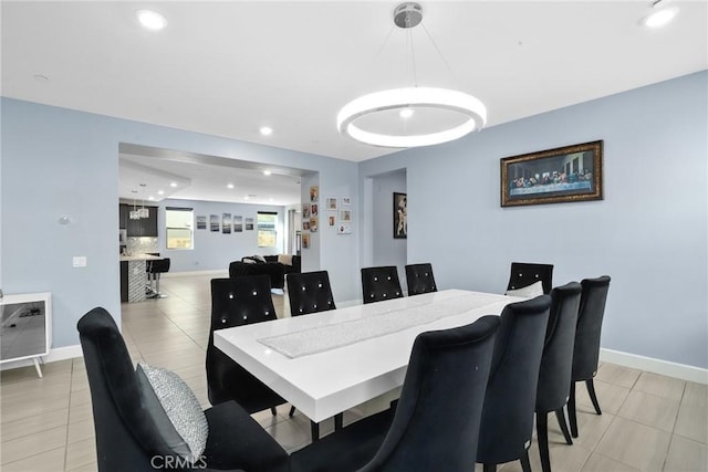 dining room featuring recessed lighting, baseboards, and light tile patterned floors