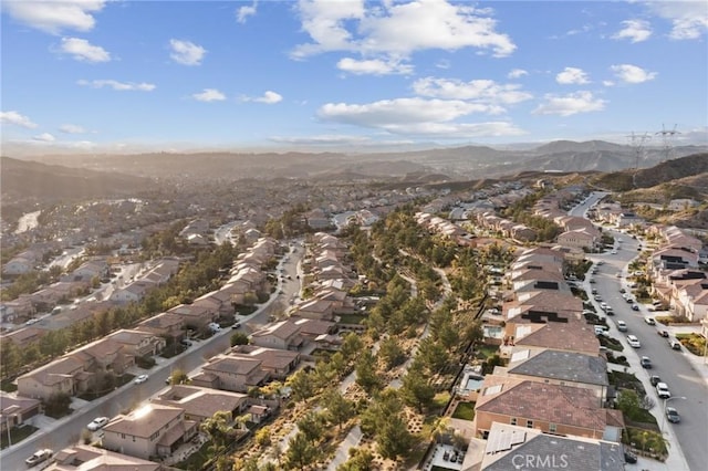 birds eye view of property featuring a mountain view and a residential view