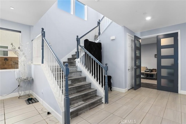 staircase featuring recessed lighting and baseboards