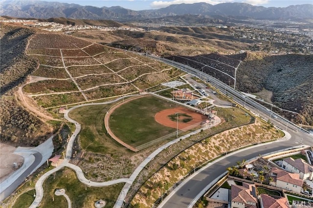 birds eye view of property with a mountain view