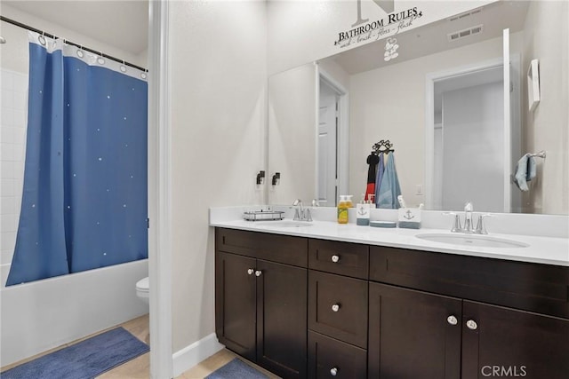 bathroom with double vanity, shower / bath combination with curtain, a sink, and visible vents