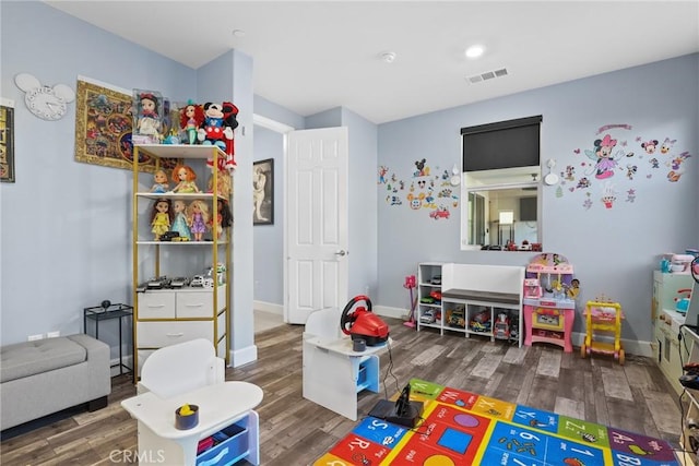 game room featuring visible vents, baseboards, and wood finished floors