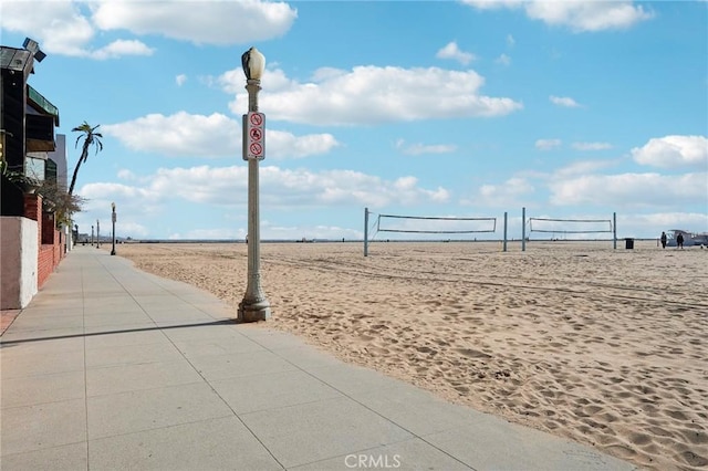 view of home's community featuring volleyball court