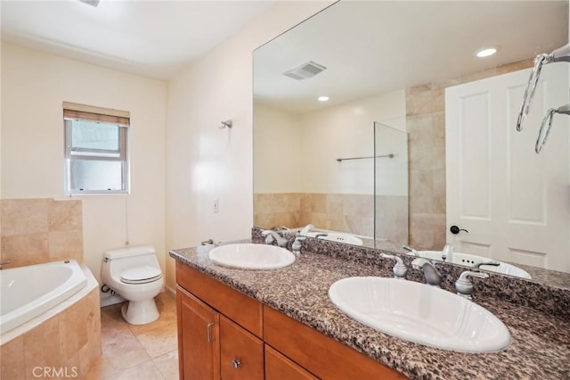 bathroom featuring a bath, visible vents, toilet, and a sink