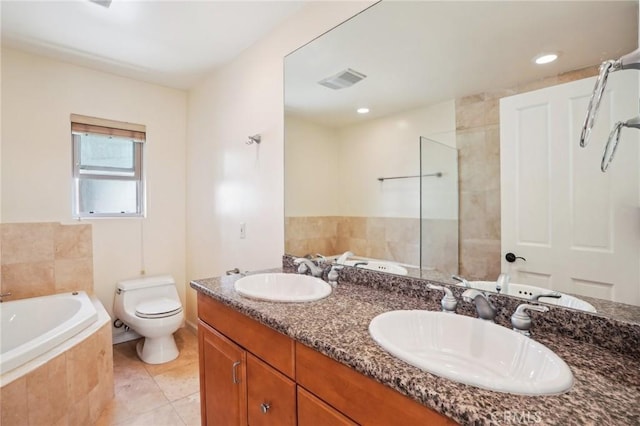 bathroom featuring a bath, toilet, a sink, and visible vents