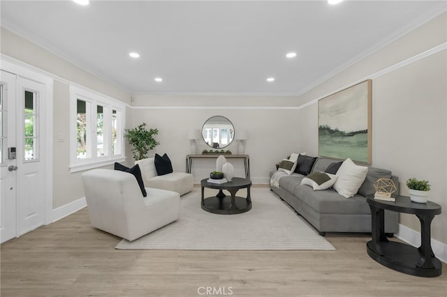 living area featuring ornamental molding, recessed lighting, wood finished floors, and baseboards