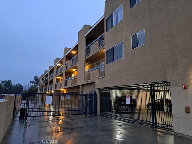 view of building exterior featuring fence