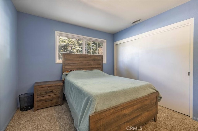 carpeted bedroom with visible vents