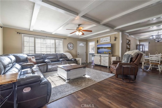 living area with ceiling fan with notable chandelier, beamed ceiling, dark wood-style flooring, and coffered ceiling