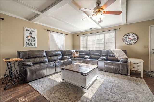 living room with baseboards, a ceiling fan, wood finished floors, and beamed ceiling